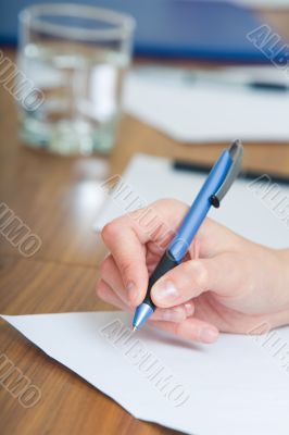 Hand with pen