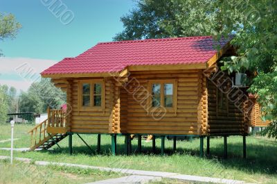 The wooden house on piles.