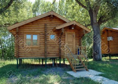 The wooden house with a porch.