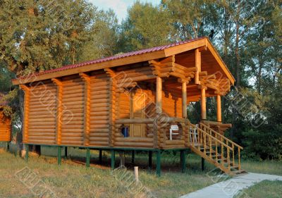 The wooden house with a porch.
