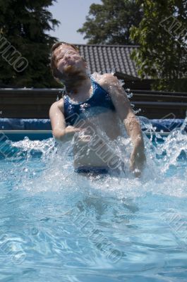 girl jumping out of the water