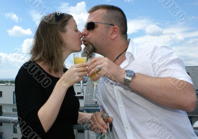 Young man, young woman give a kiss.
