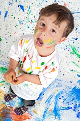 Boy playing with painting