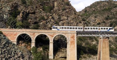Train on the bridge through a precipice, Corsica
