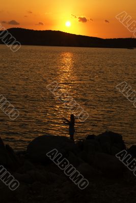 Fishing on soft sunset on Sardinia
