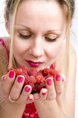 Blonde woman with raspberries