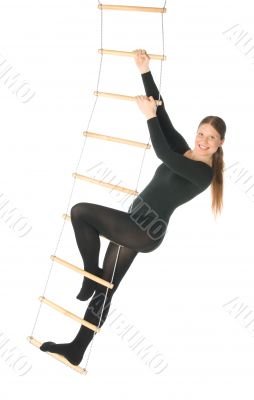 Woman on a rope ladder