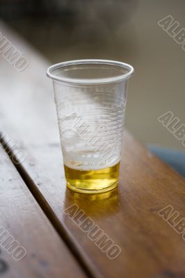 cold beer in the plastic glass