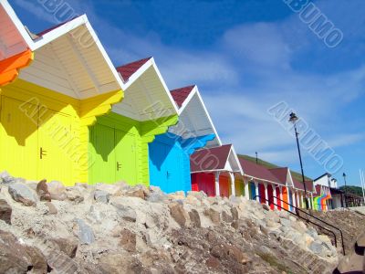 Colorful beach chalets by seaside