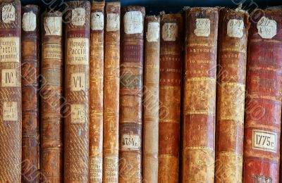 Row of old books cover spines