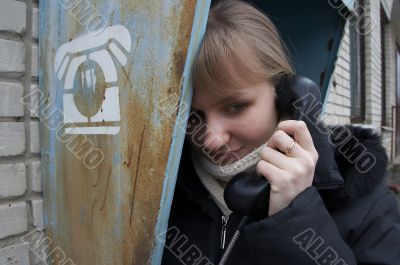 Upset girl with street phone