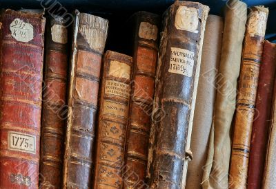 Row of old books cover spines
