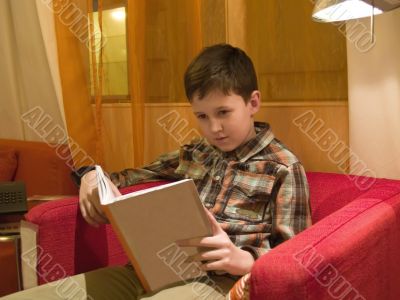 Boy readind a book