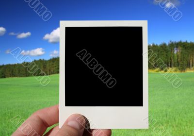 hand holding blank photo