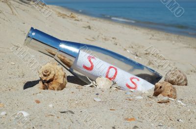 Message in a bottle with SOS signal