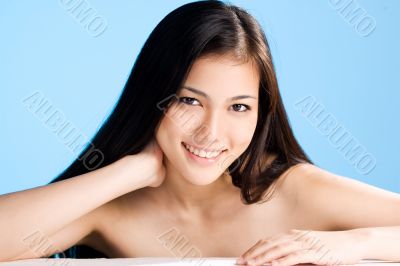 beautiful young asian girl  on blue background