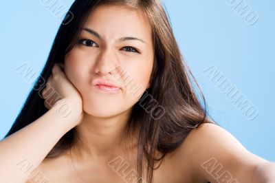 beautiful young asian girl  on blue background