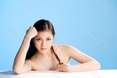 beautiful young asian girl  on blue background