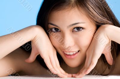 beautiful young asian girl  on blue background