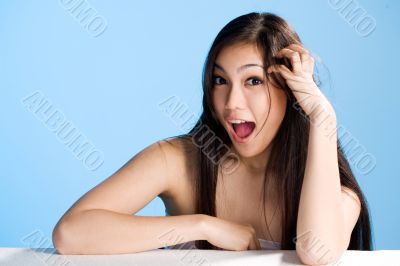 beautiful asian woman on blue background