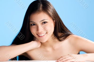 beautiful asian woman on blue background