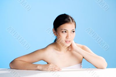 beautiful asian woman on blue background