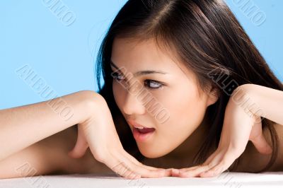 beautiful asian woman on blue background