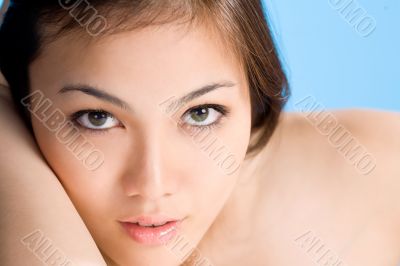 beautiful asian woman on blue background