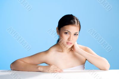 beautiful asian woman on blue background