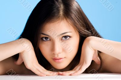 beautiful asian woman on blue background