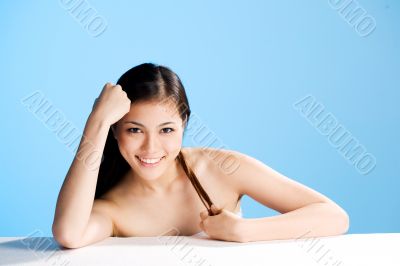 beautiful asian woman on blue background