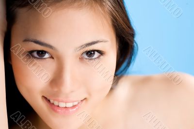 beautiful asian woman on blue background