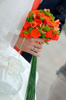 Brides hand holding bouquet