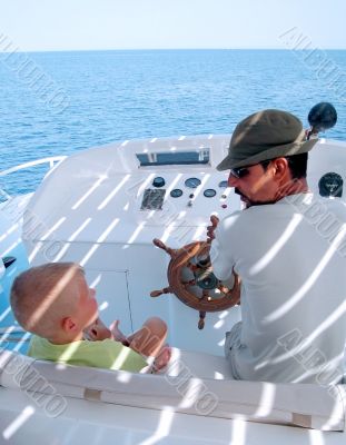little boy and captain on the boat