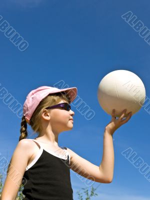 girl in sun glasses with ball