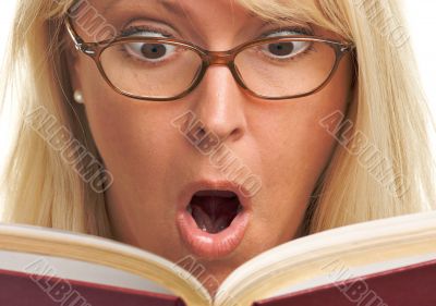 Attractive Woman Taken Back While Reading