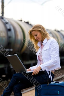 young lady waiting a train