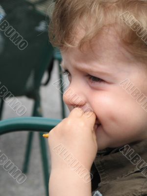 boy eating french fries