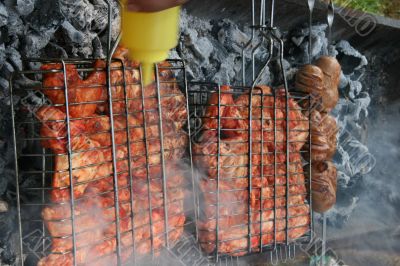 Preparing meat barbecue upon open fire