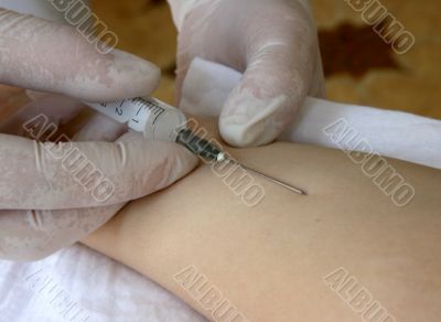 nurse hand with syringe doing injection