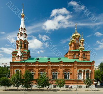 Christian temple with domes on a background of clouds