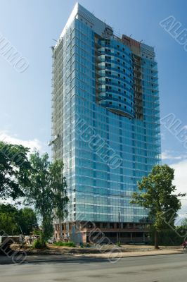 A under construction skyscraper on a background of the sky