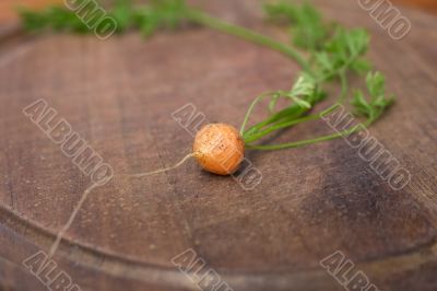 baby carrot on a chopping board
