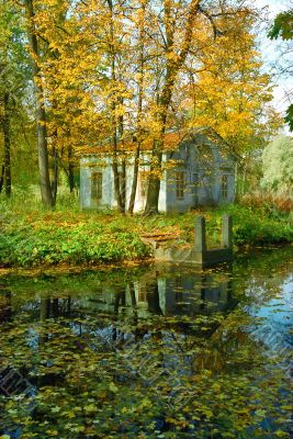 Ancient cottage and quay in the park