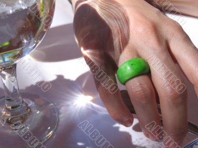 green ring on a female`s hand