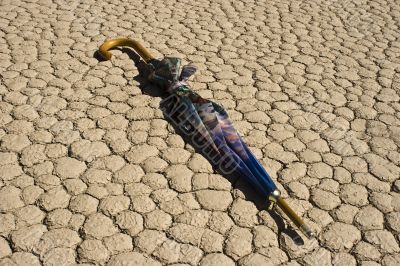 Umbrella on Cracked, Parched Earth