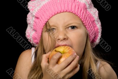 little girl eating apple