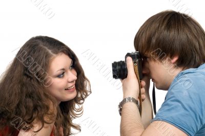 Photographer taking pictures of the young woman