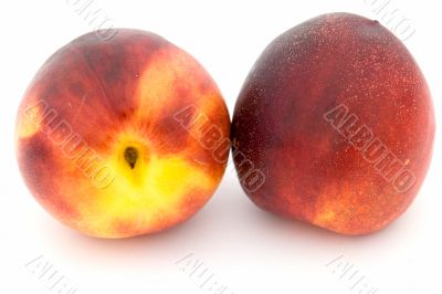 Two ripe nectarines
