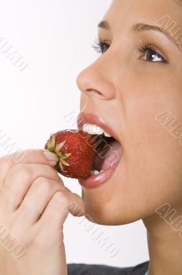 Bitting into a strawberry